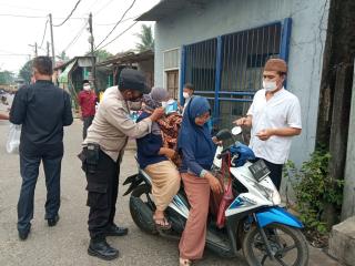 Gebrakan Masker dan Edukasi Kepada Warga Masyarakat Pengguna Jalan