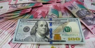 Rupiah Ditutup Melemah ke Rp18.022 per Dolar AS, Pasar Respons Keputusan BI